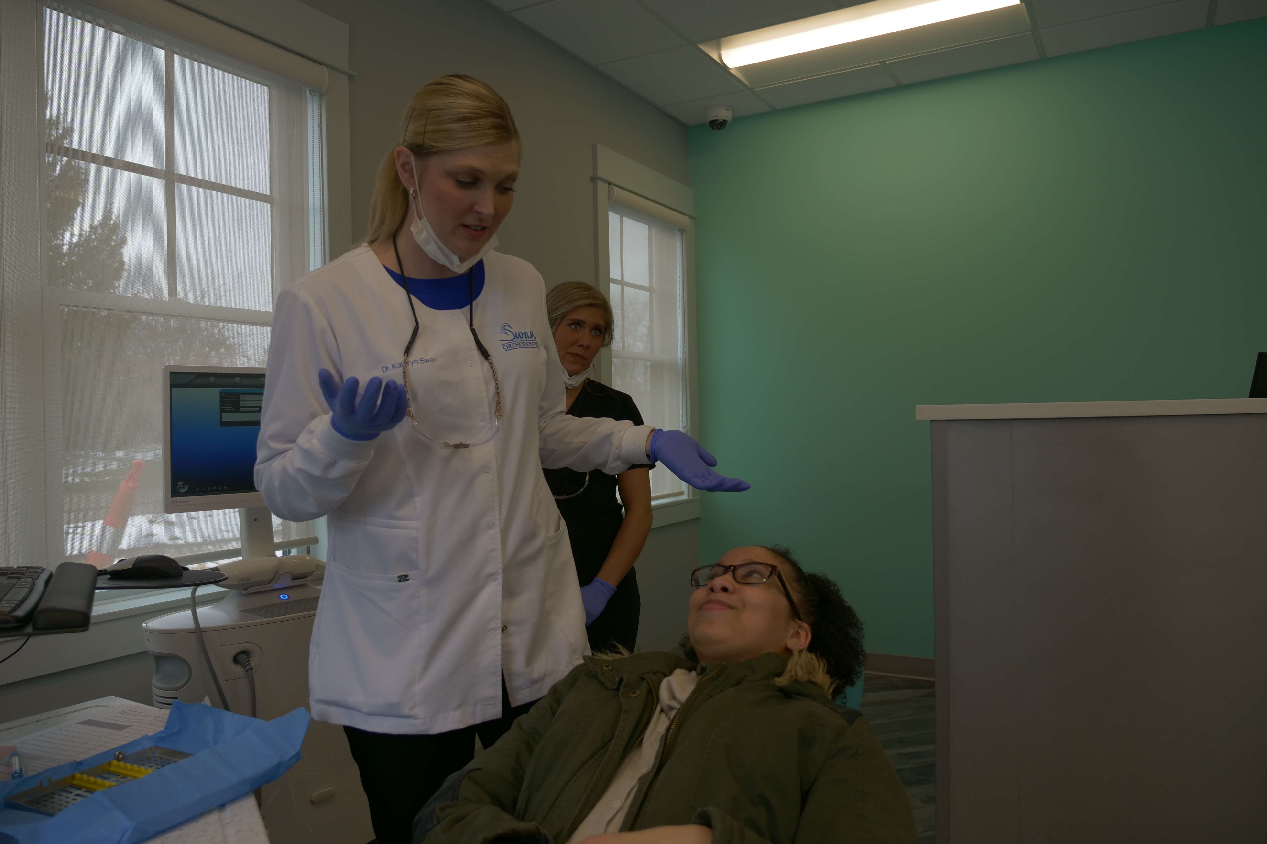 Swan staff talking with a patient