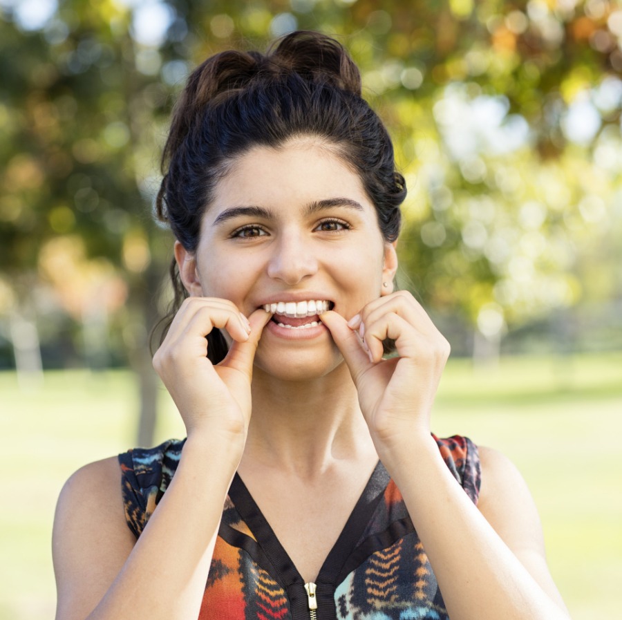 teen girl wearing invisalign