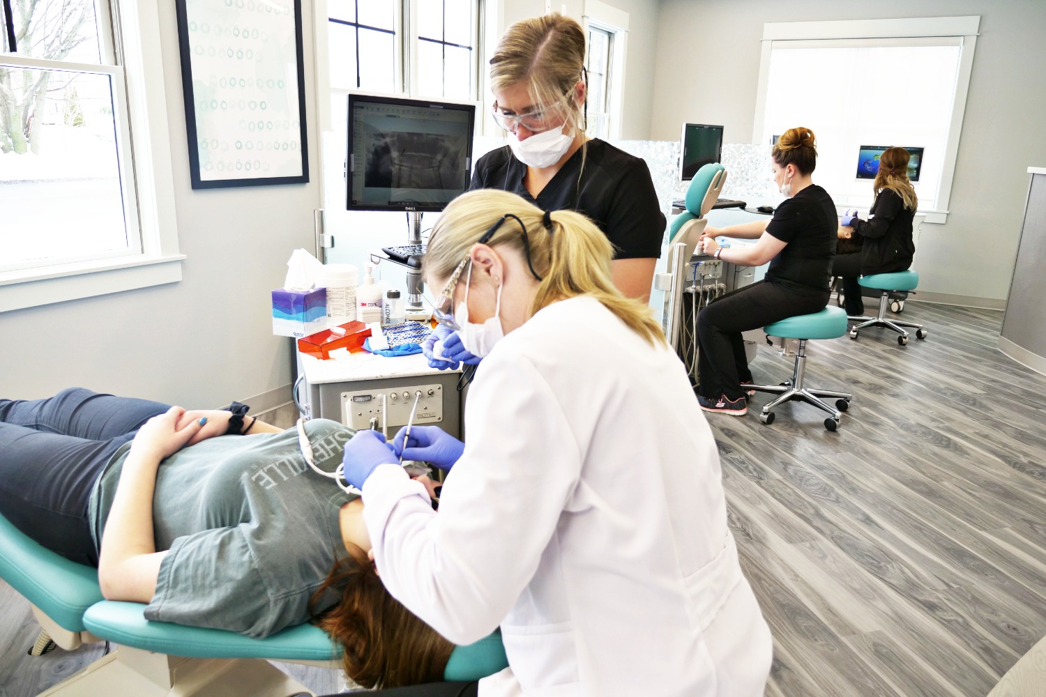 office staff helping young patient