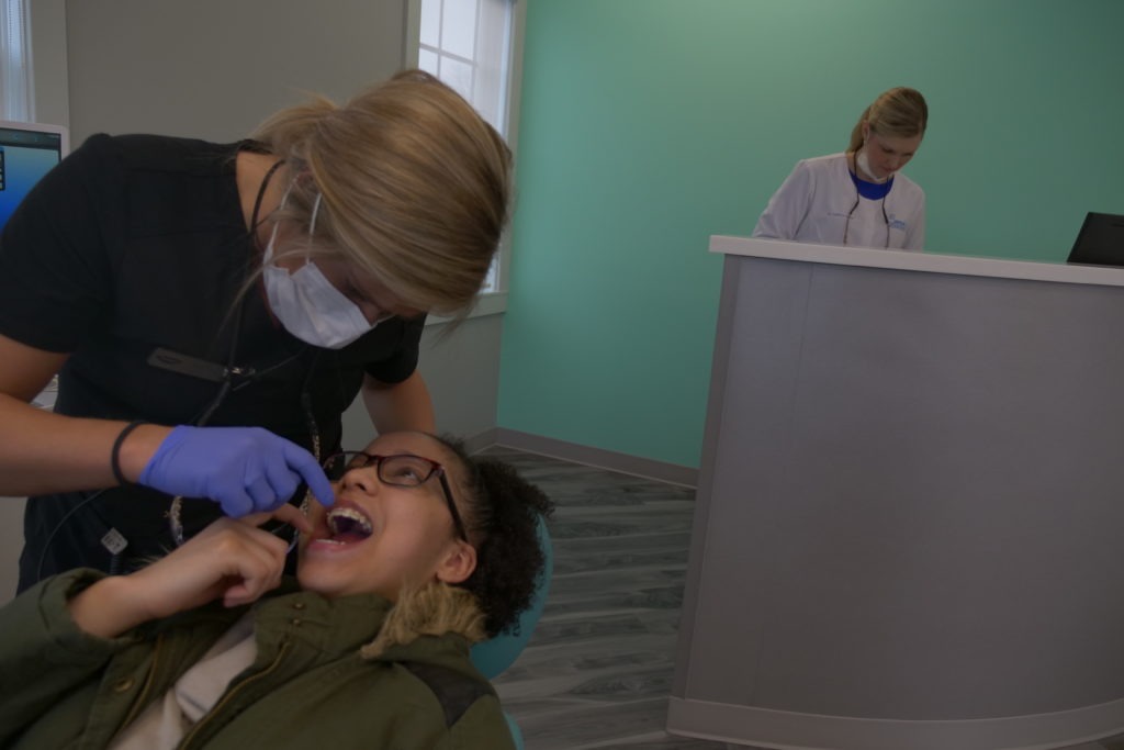 Swan staff working with a patient