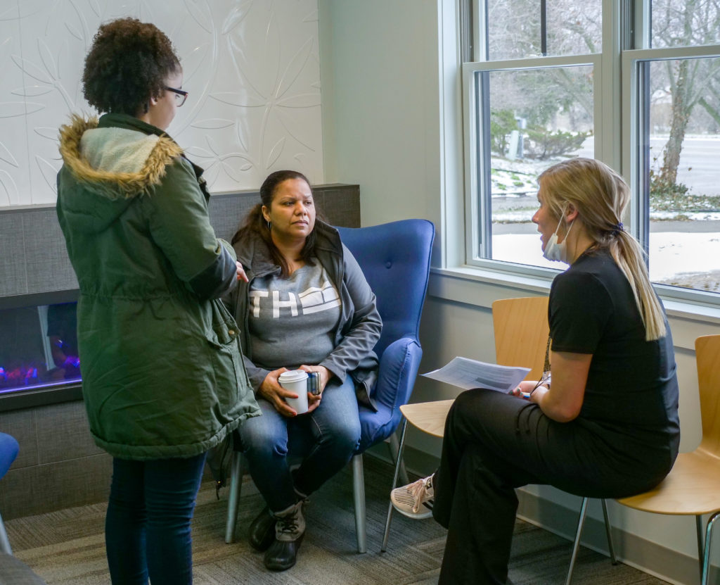 Swan staff talking to a family