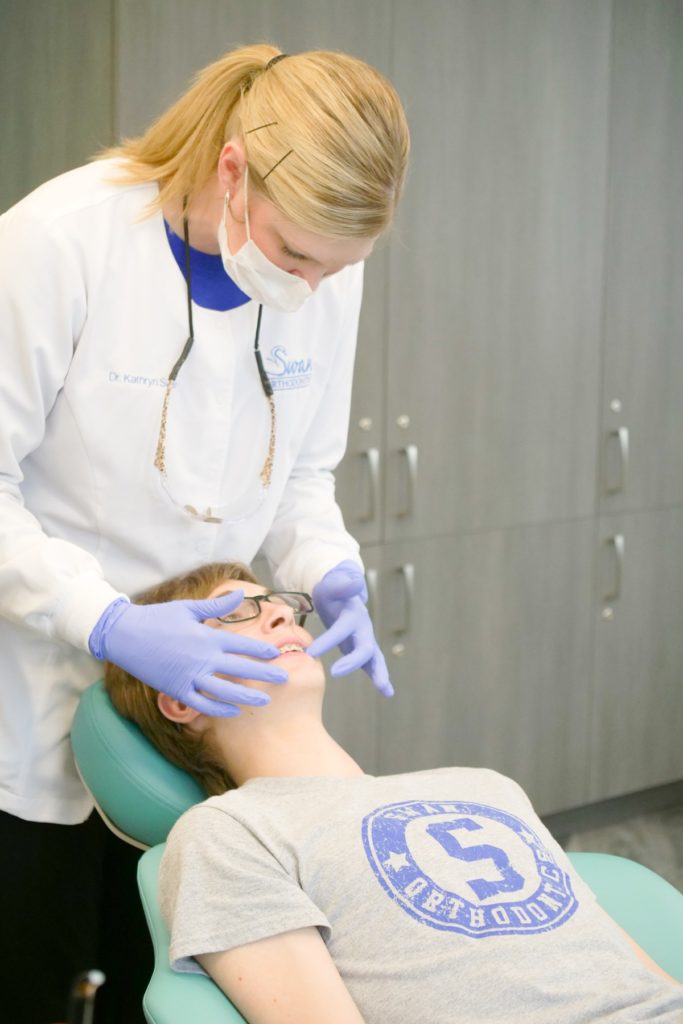 Dr. Swan working on a patient's teeth