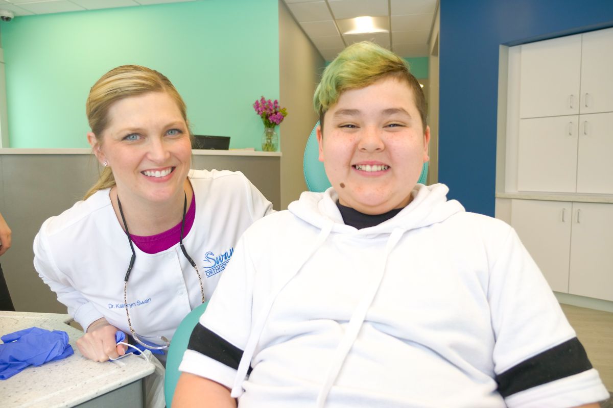 Dr. Swan smiling with a patient